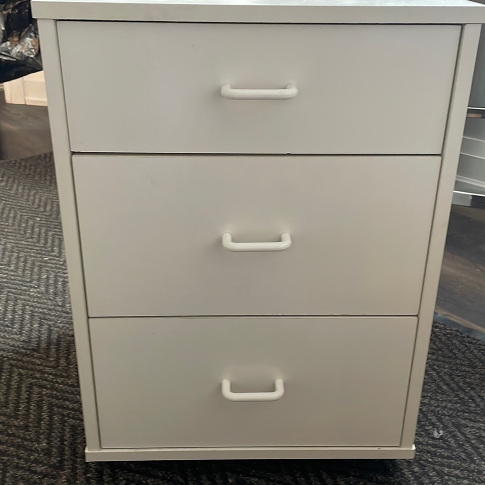 Side drawer with wheels.